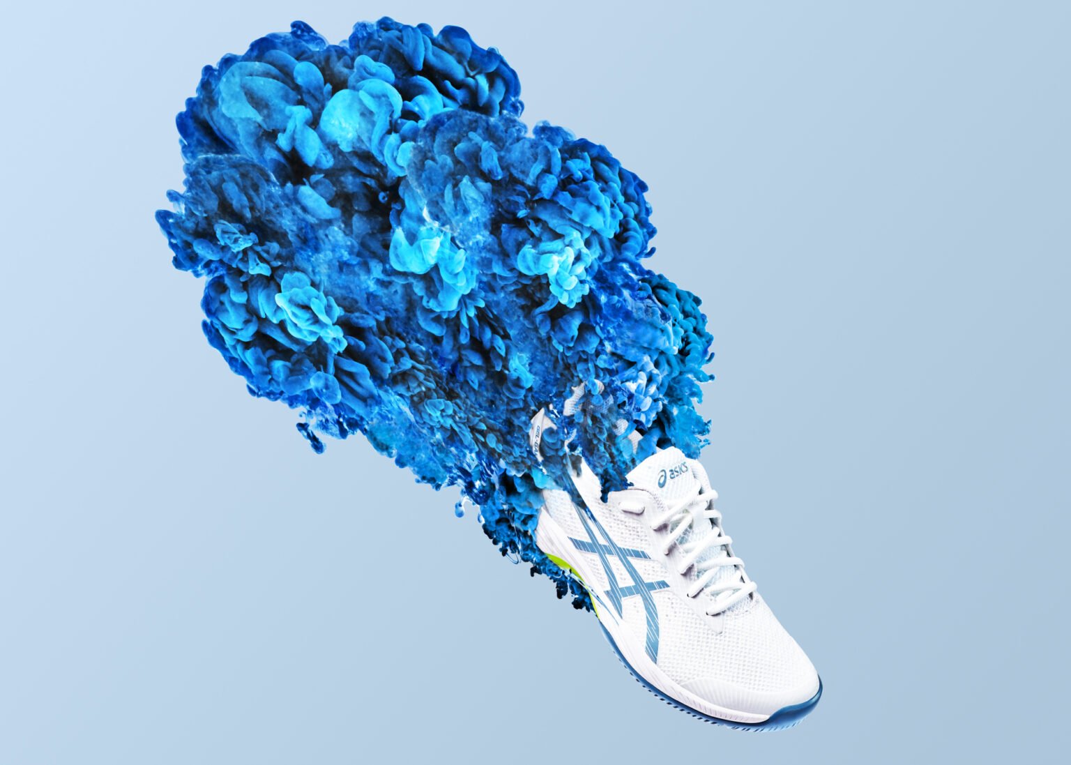 White ASICS Gel-Dedicate trainer trailing a burst of blue smoke-like cloud effect