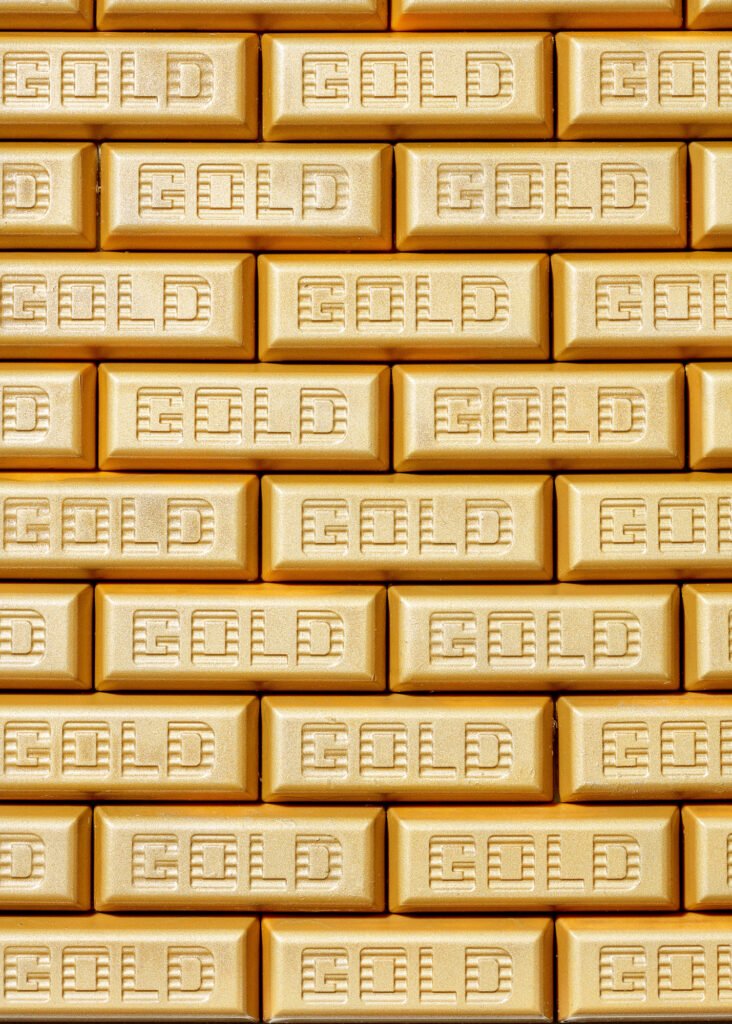 Macro photo of gold chocolate bars painted gold