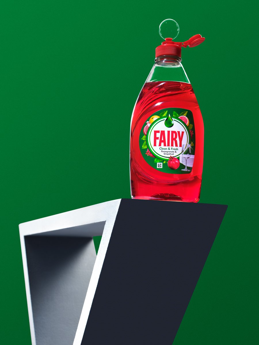 Bottle of Fairy Clean & Fresh washing-up liquid, Pomegranate & Grapefruit scent, on a display stand