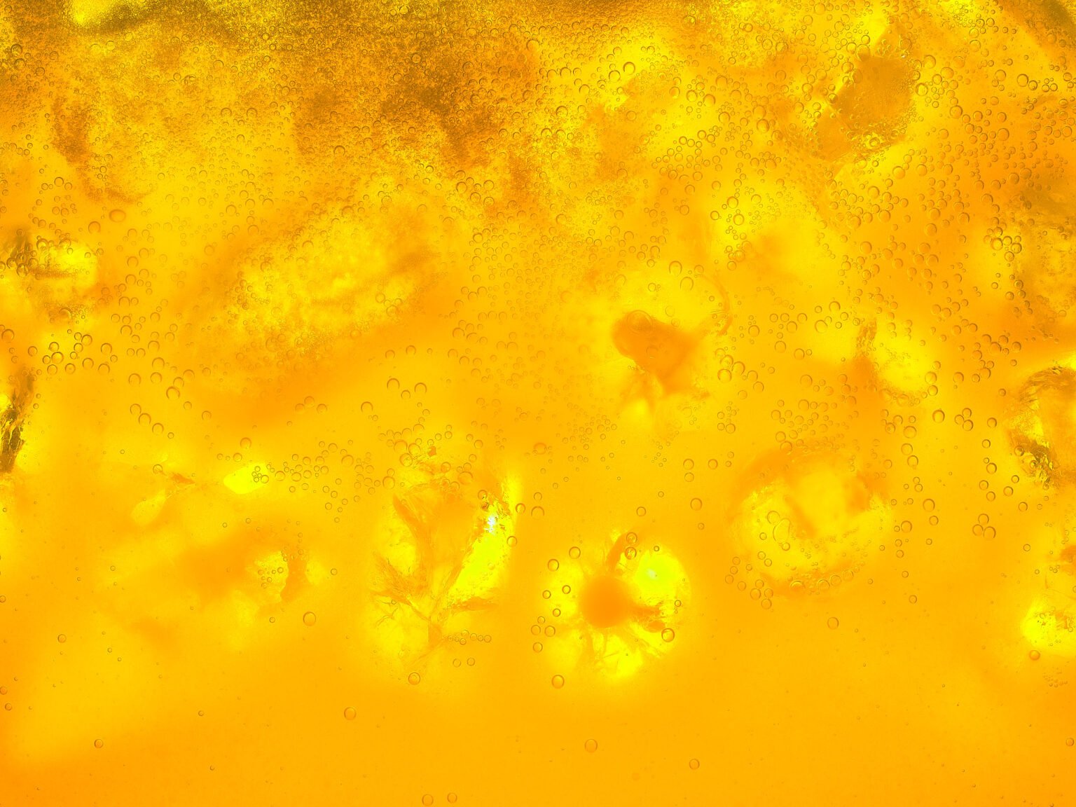 macro photograph of a fizzy drink with ice