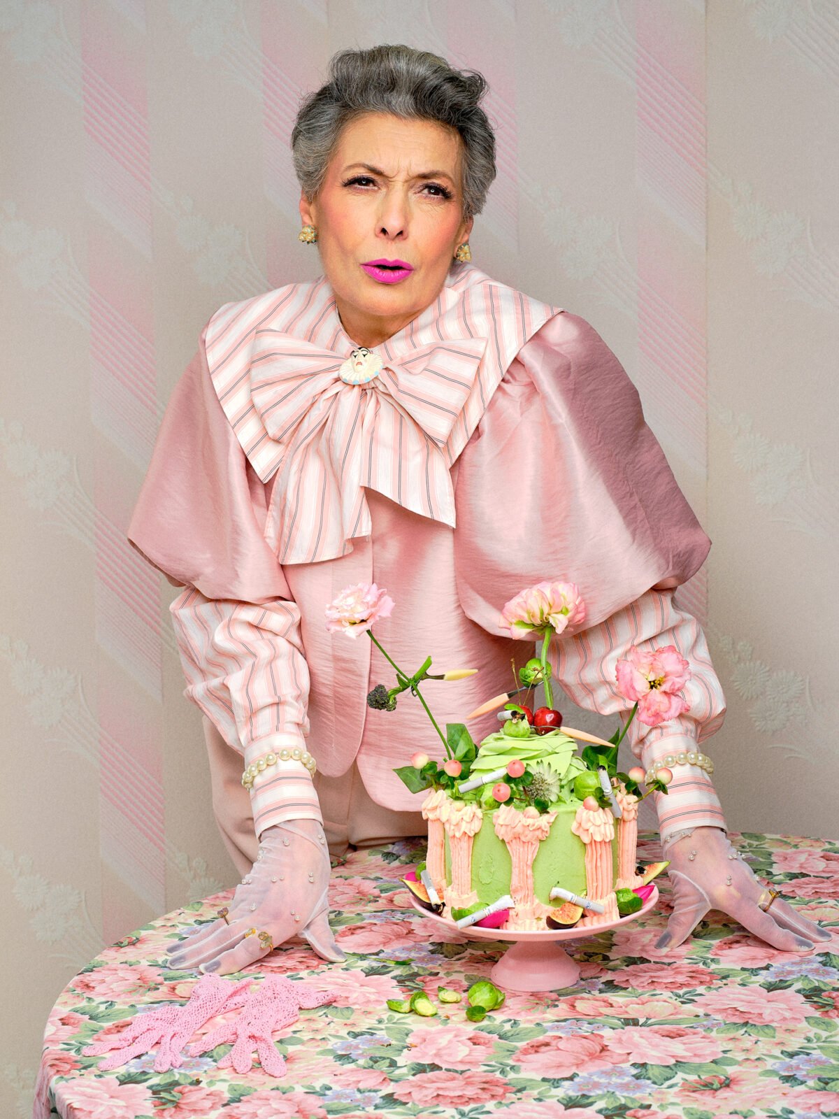 photograph of an older lady in a floral set with a brilliant facial expression