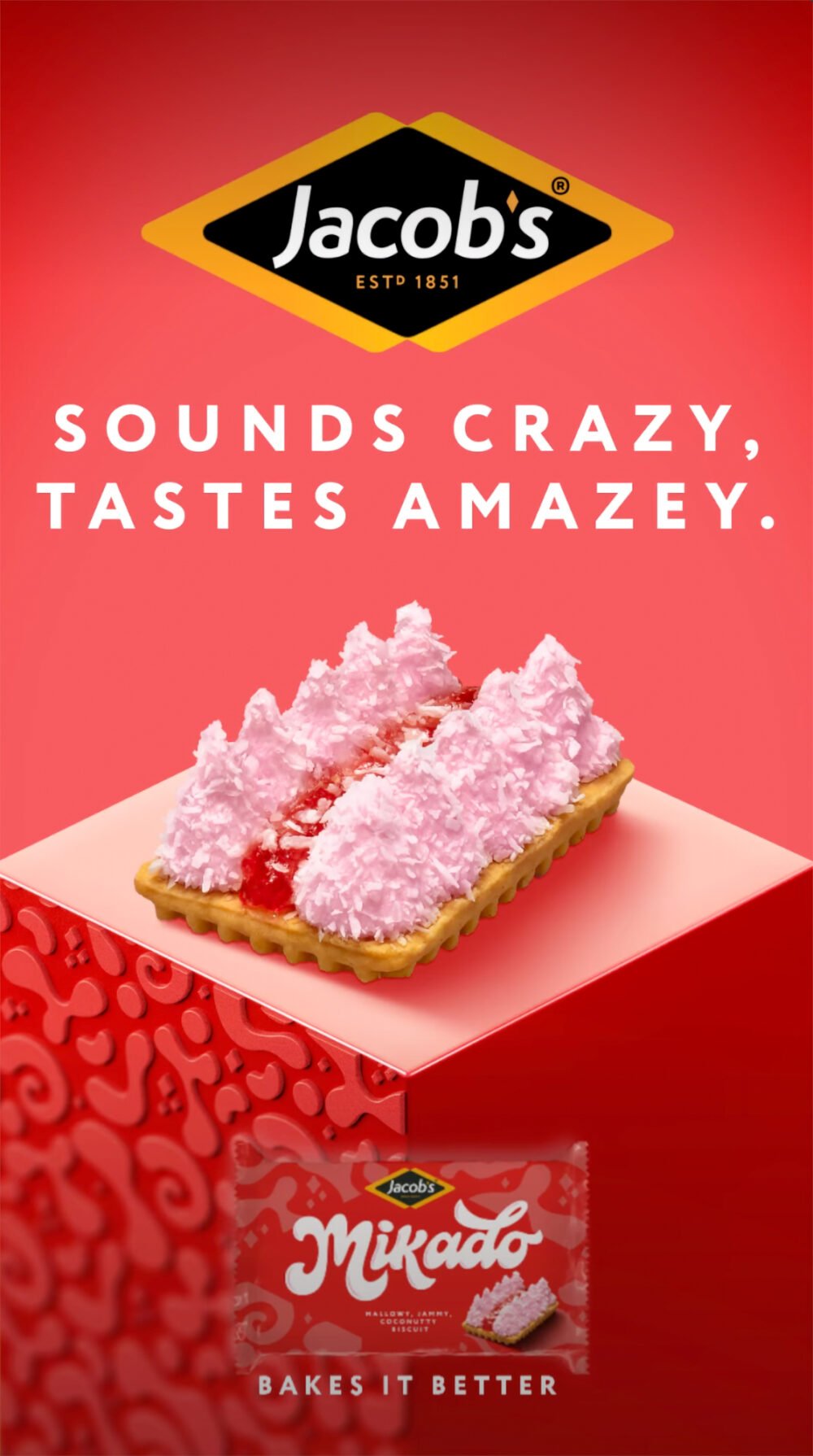 Jacob's advert: "Sounds crazy, tastes amazey." A biscuit topped with jam and pink coconut peaks, above a pack of Mikado marshmallow, jammy, coconutty biscuits. Bakes it better