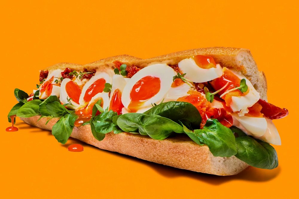 Over the top baguette with eggs looking funny